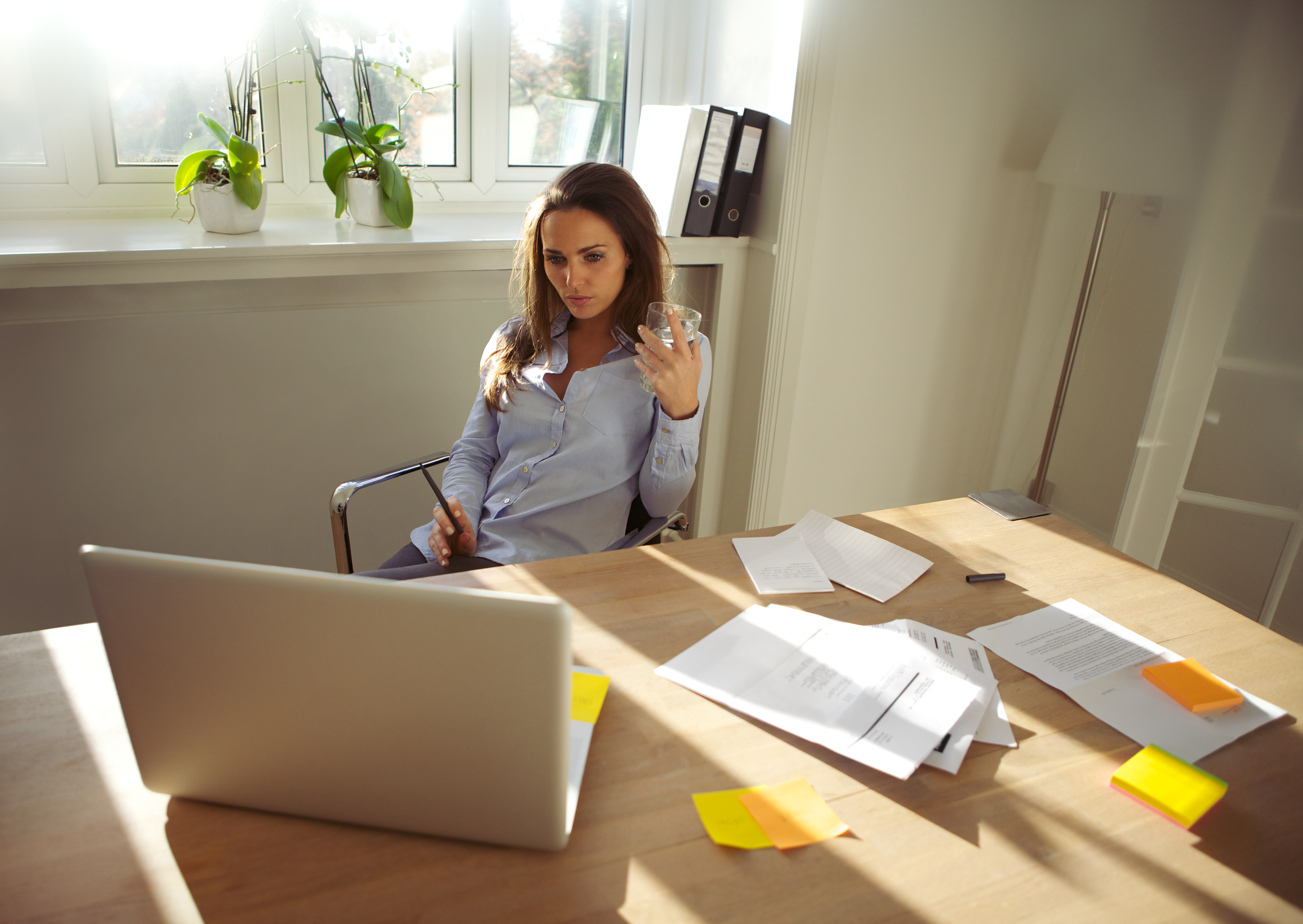 woman-working-in-her-home-office_Two_CasAssets.jpg
